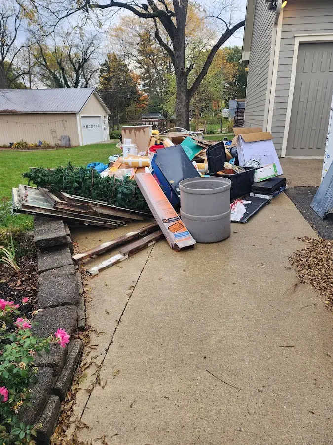 Dumpster being loaded with debris for 30 Yard Dumpster Rental in Summersville